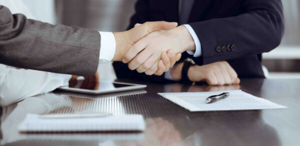 Client growth shaking hands